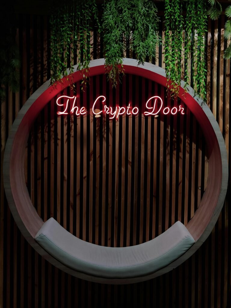 Circular seat with neon sign 'The Crypto Door' against a modern slatted backdrop.